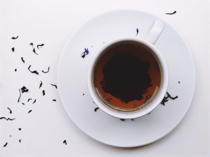 A cup of tea with dried leaves