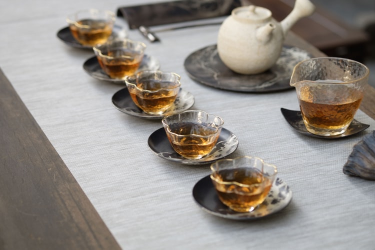 Clear glass cups filled with tea