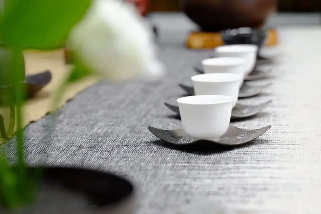 Tea cups on a saucer lined perfectly