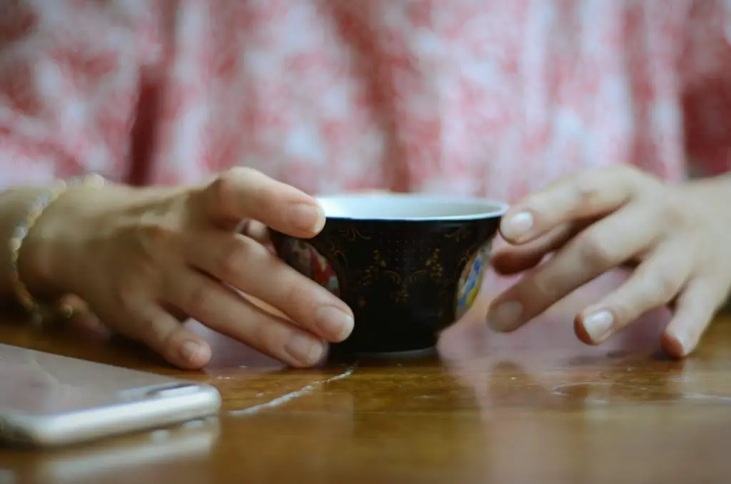 Person holding a teacup