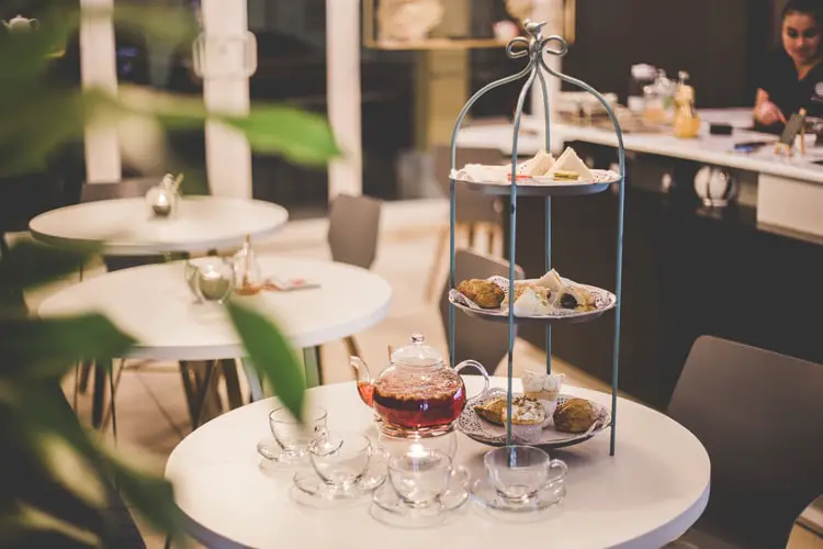 Afternoon tea being served with various kinds of snacks