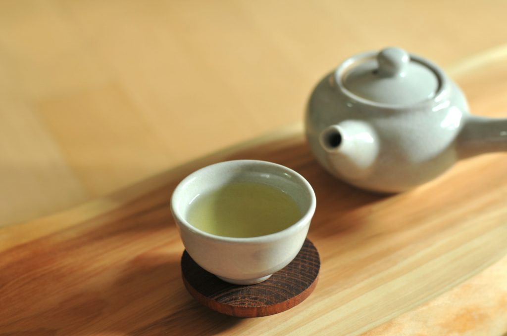 White ceramic tea set on wooden table