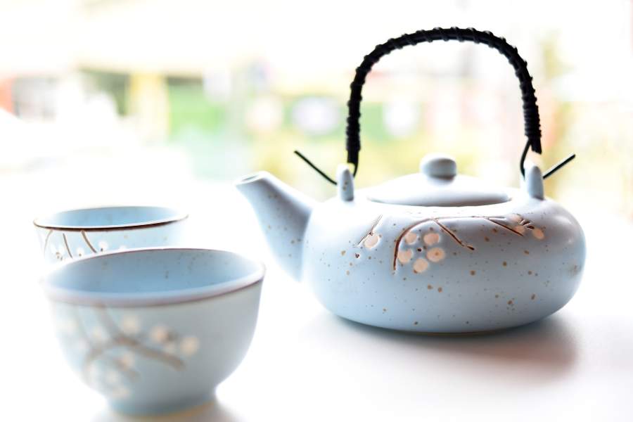 A light blue floral tea set