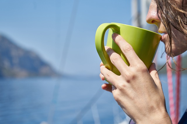 Woman enjoying a cup of Loose Leaf Tea in a mug